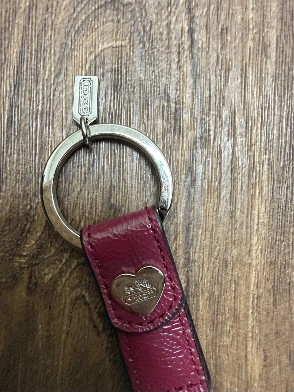 Coach Burgundy Leather Key Strap with Heart Medallion